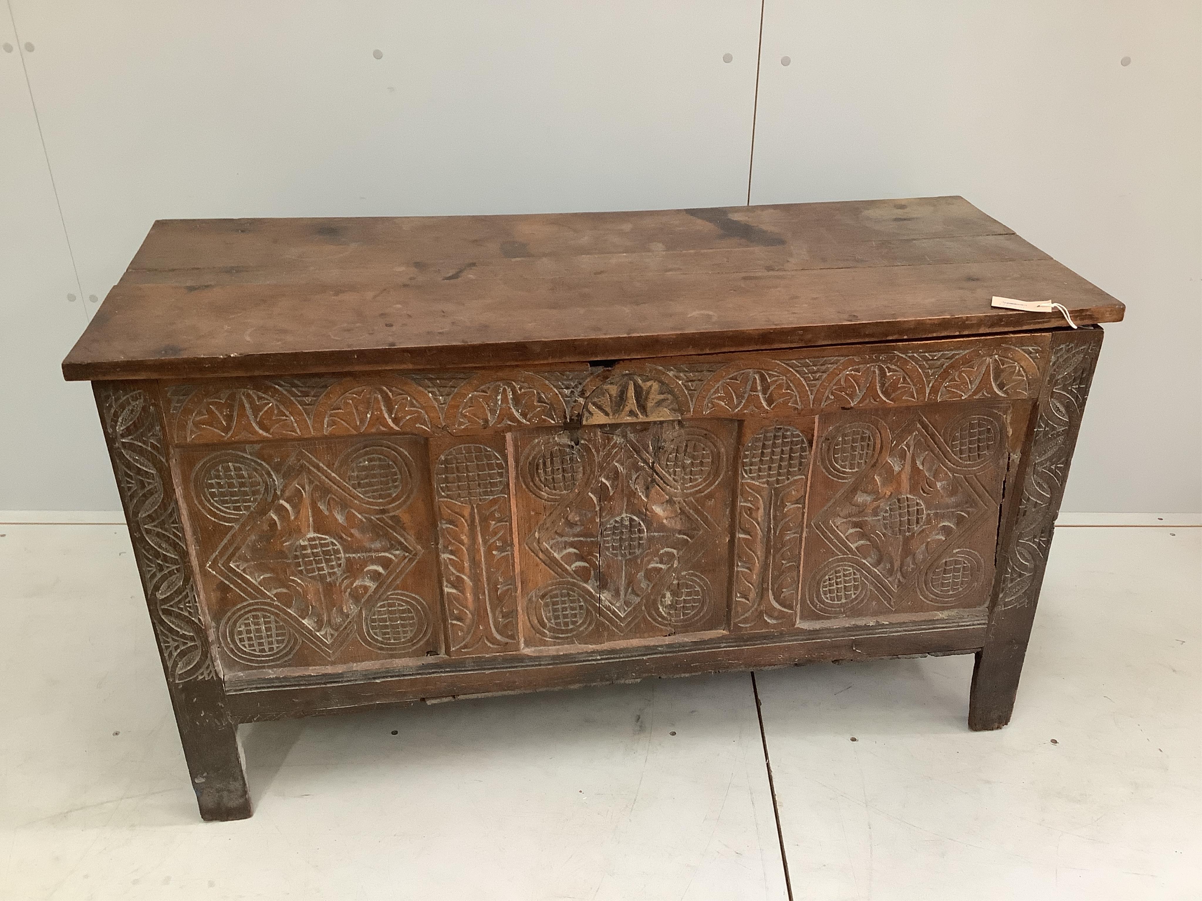 A carved coffer, width 127cm, depth 50cm, height 72cm